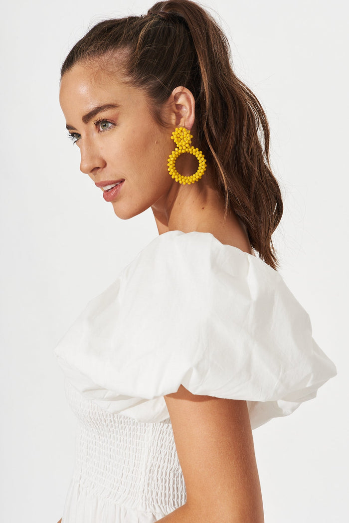 August + Delilah Poarch Bead Earrings In Mustard - side