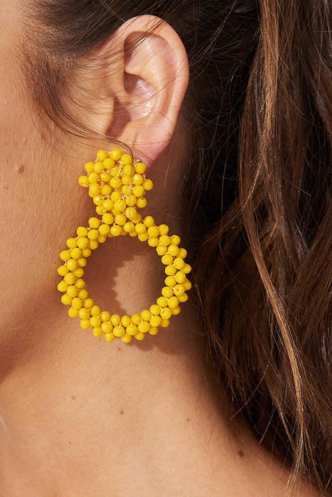 August + Delilah Poarch Bead Earrings In Mustard - side close up