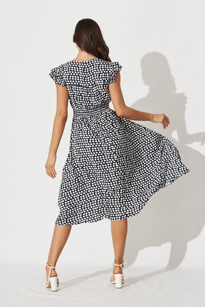 Kylian Midi Dress In Navy With White Polka Dot - back
