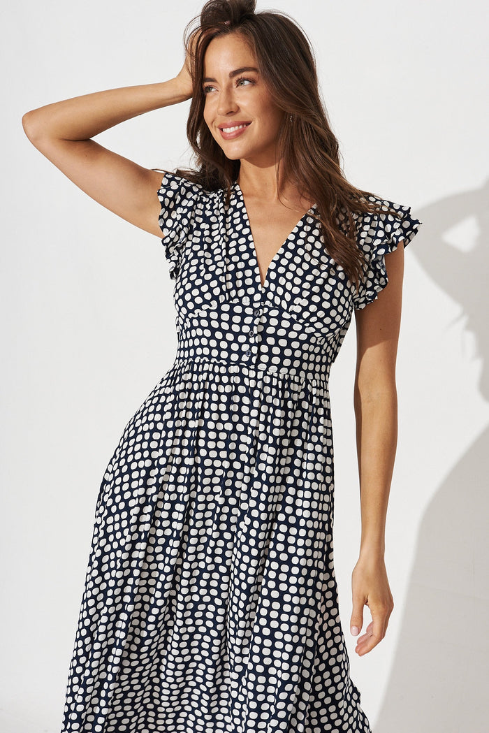 Kylian Midi Dress In Navy With White Polka Dot - front