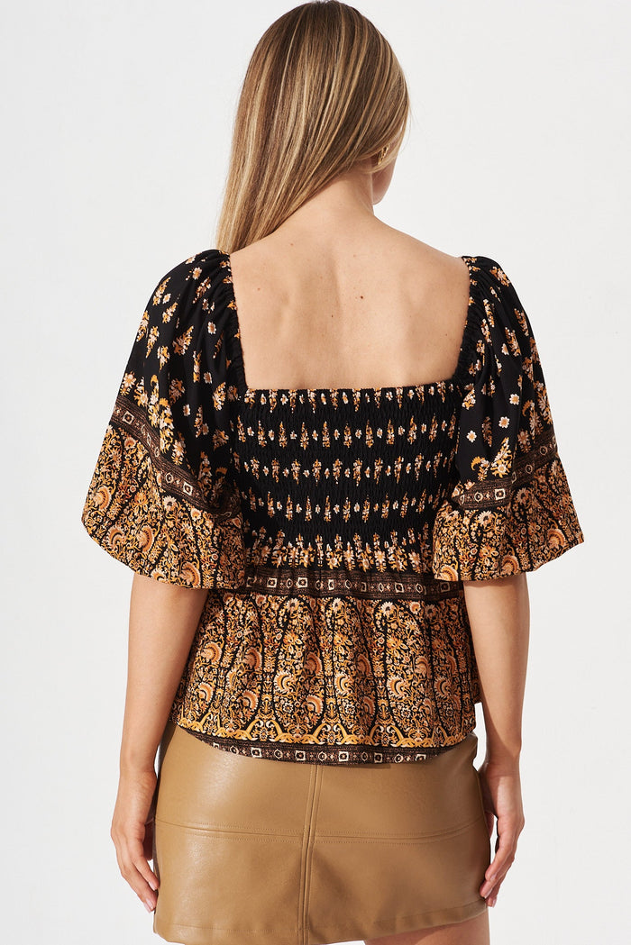 Nardine Smock Top In Black With Orange Boho Floral - back