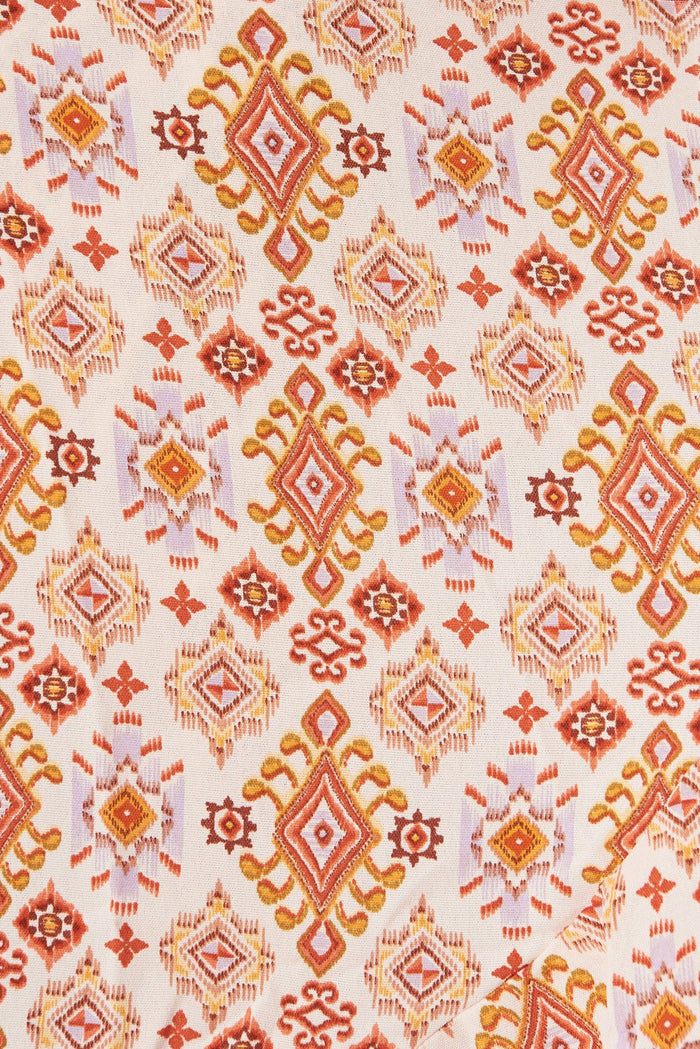 Felicidad Midi Wrap Dress In White With Rust Aztec - fabric
