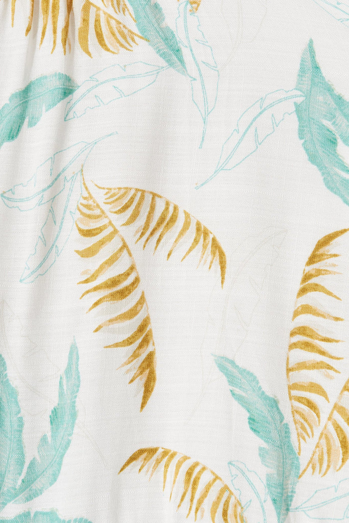 Aine Dress In White With Green Tropical Leaf - fabric