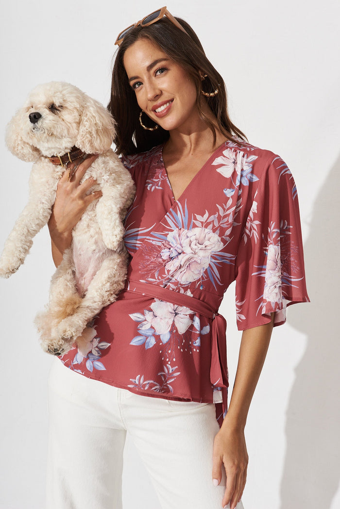 Pippa Wrap Top In Rust With Blush Floral - front with puppy