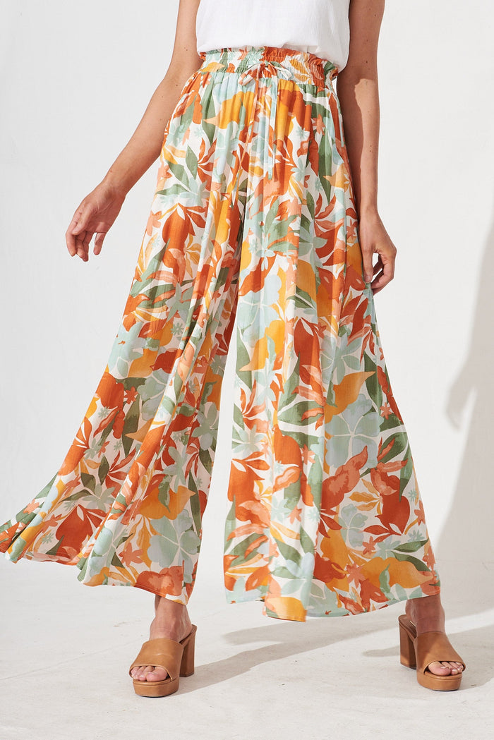 Mariah Pants In White With Orange Leaf Print - front