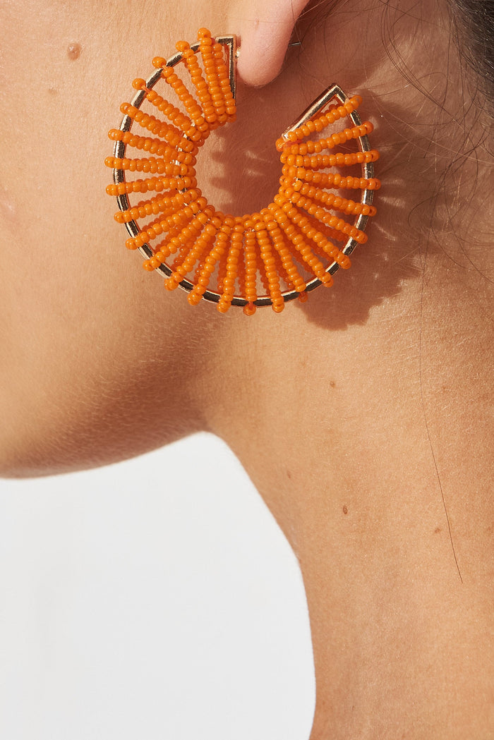 August + Delilah Nyda Hoop Earrings In Orange - side close up