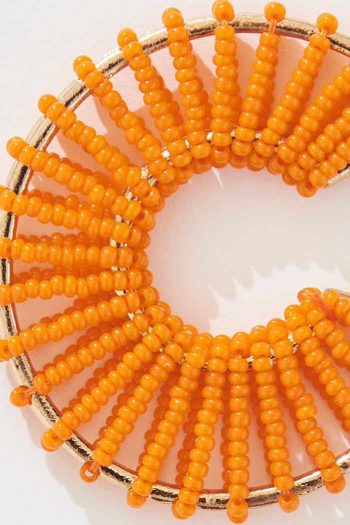 August + Delilah Nyda Hoop Earrings In Orange - detail close up