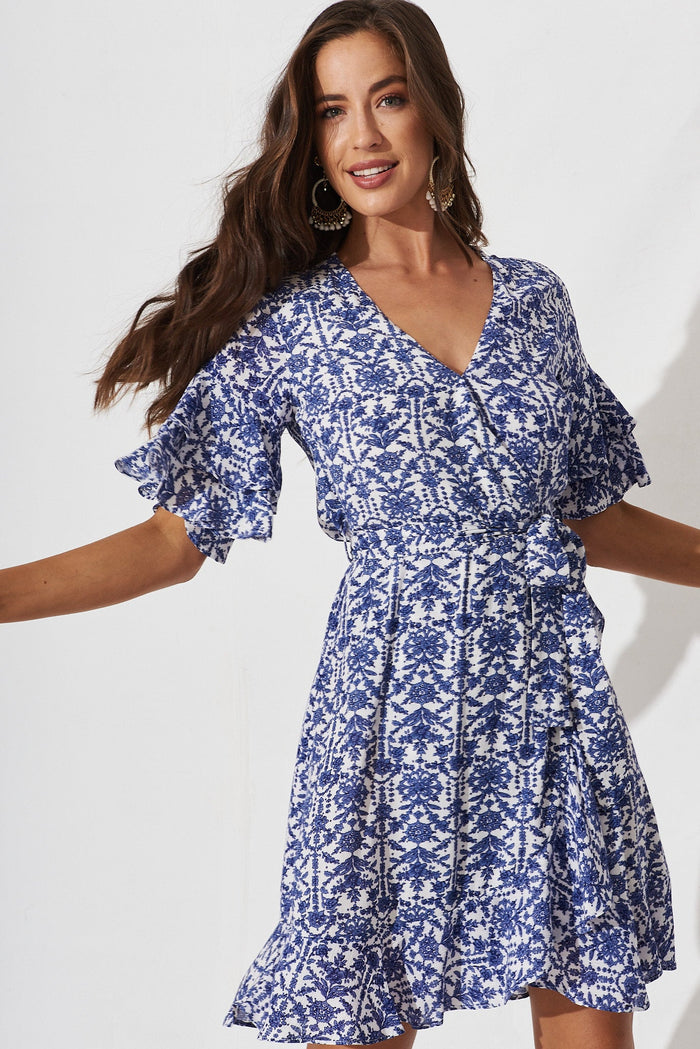 Keeyen Wrap Dress In White With Blue Floral - front