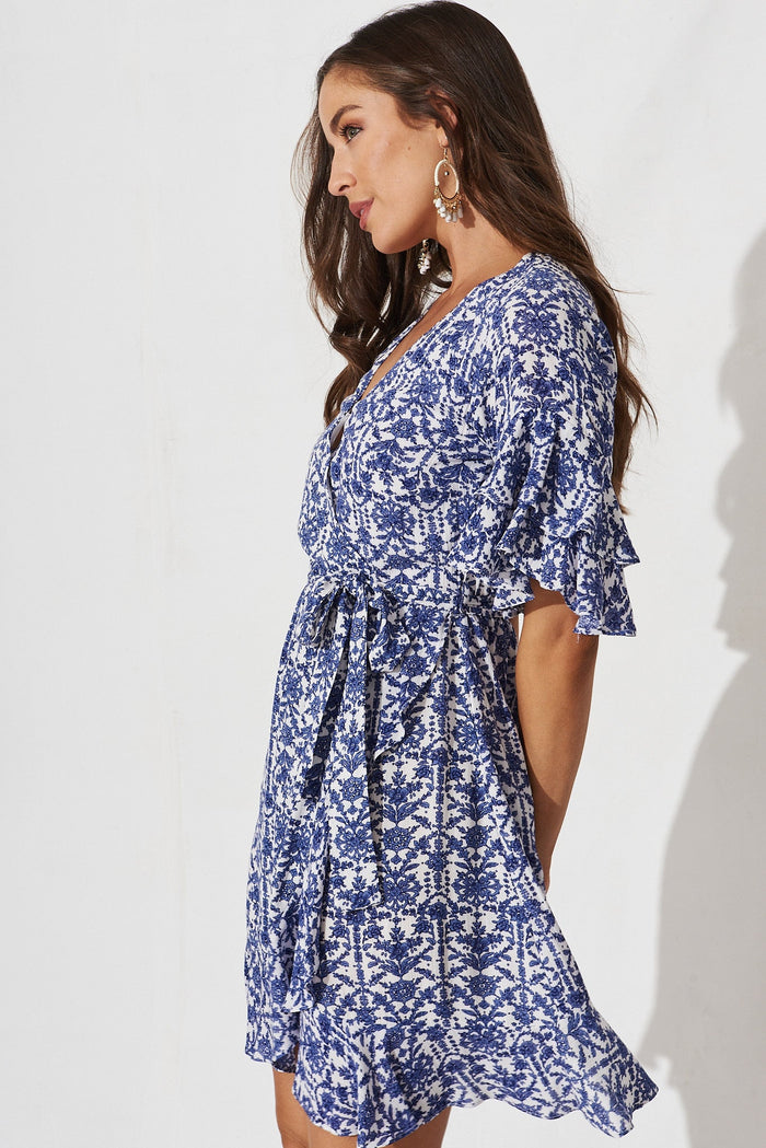 Keeyen Wrap Dress In White With Blue Floral - side