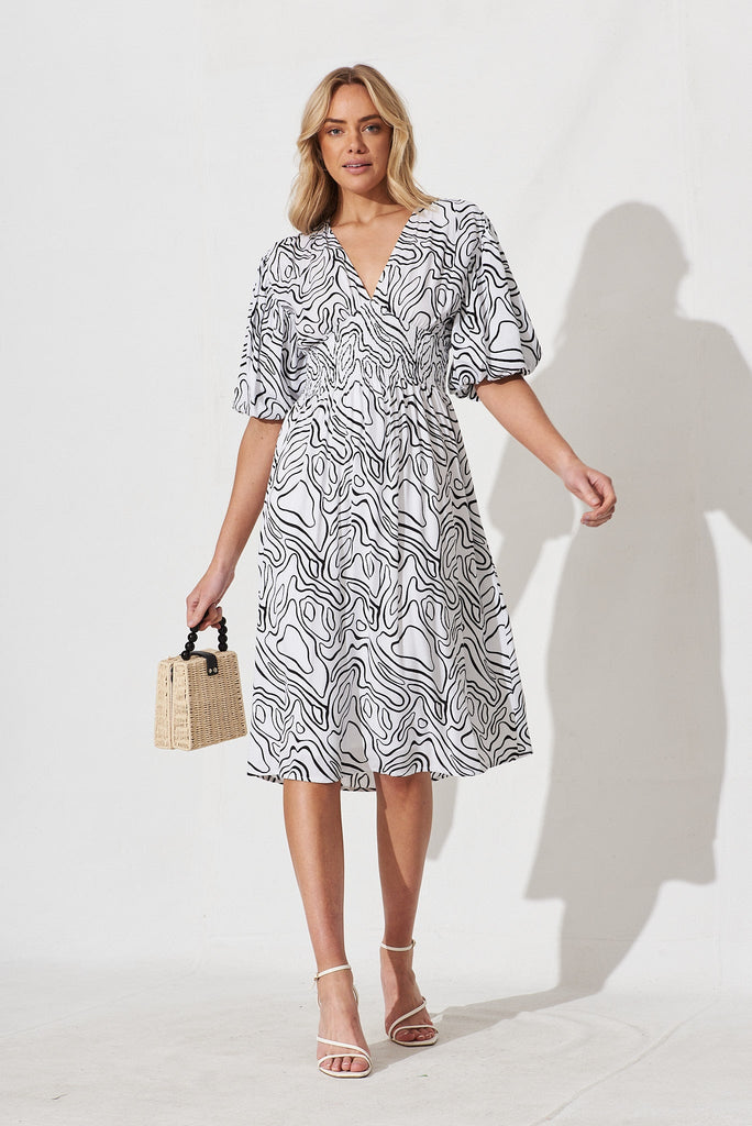 Jecci Midi Dress In White With Black Abstract Print - full length