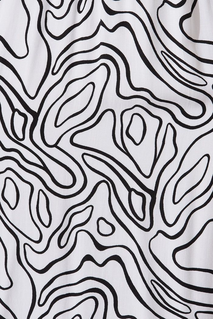 Jecci Midi Dress In White With Black Abstract Print - fabric