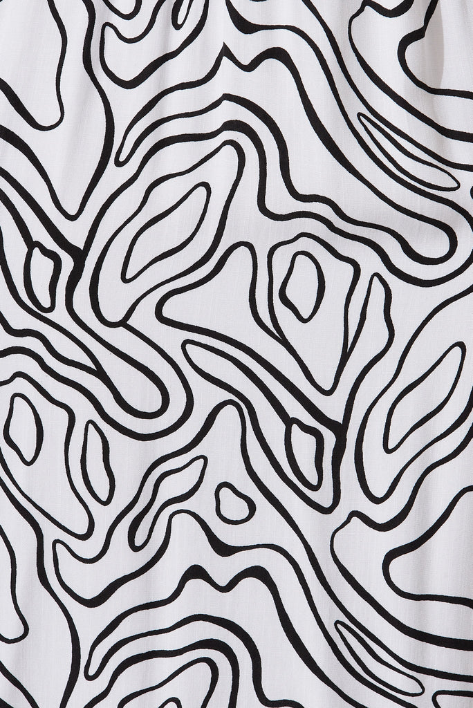 Jecci Midi Dress In White With Black Abstract Print - fabric