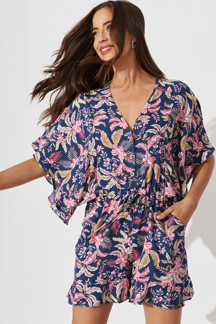 Shella Playsuit In Navy With Blush Floral - front