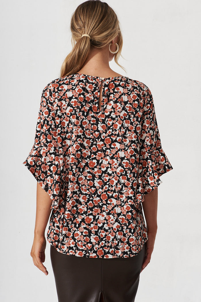 Nila Top In Black With White And Red Floral - back