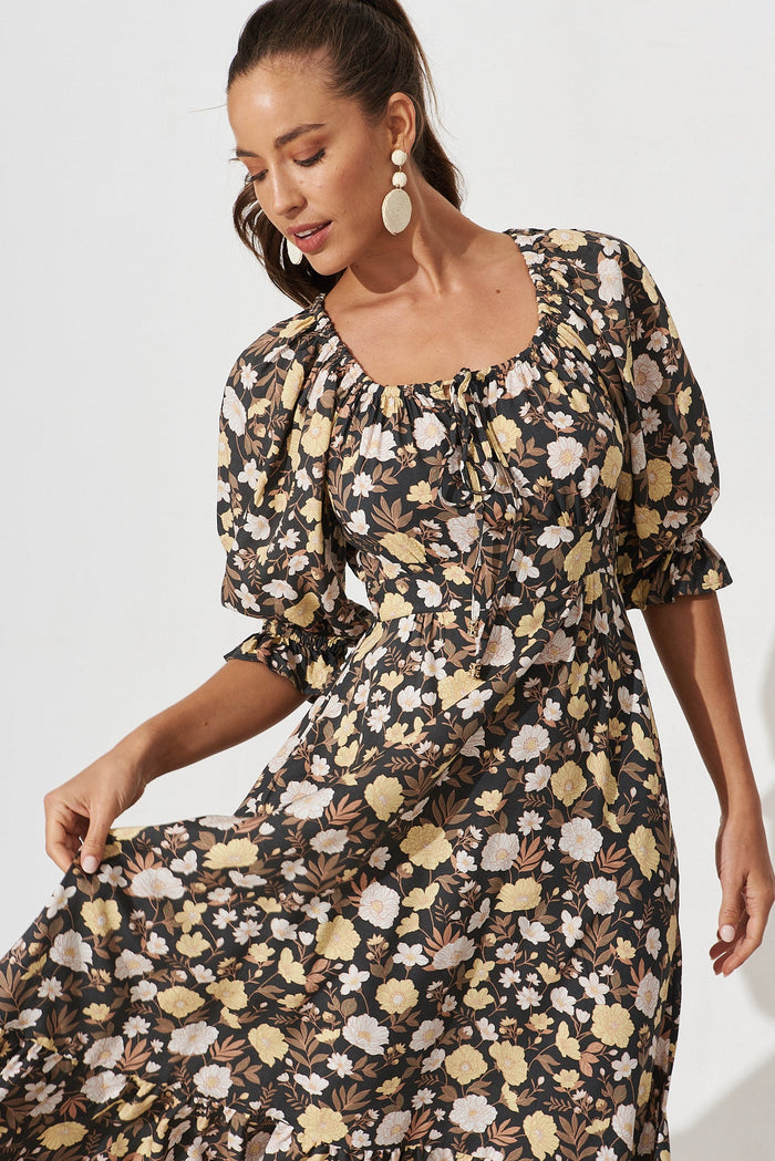 Poppy Midi Dress In Black With Brown And Yellow Floral - front