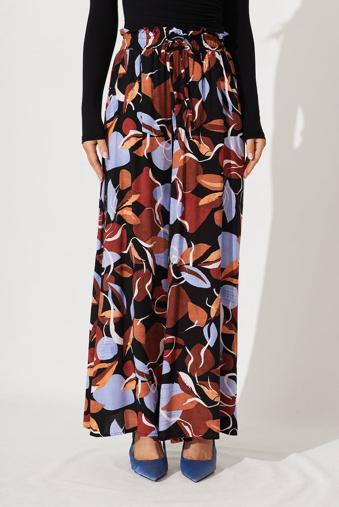 Mariah Pant In Black With Brown And Blue Leaf Print - front