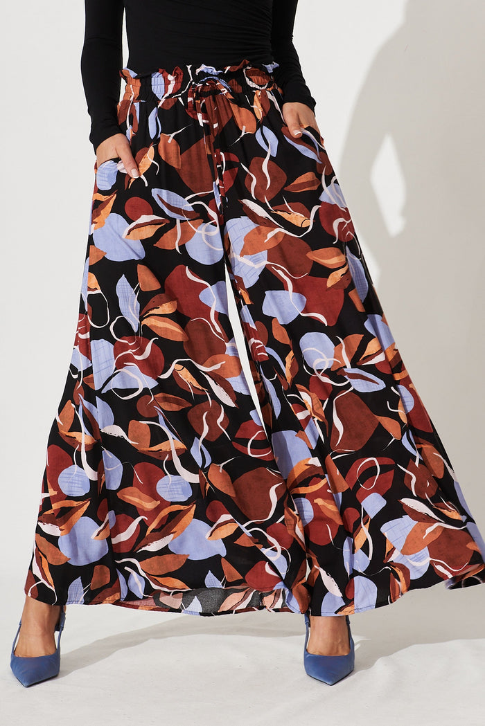 Mariah Pant In Black With Brown And Blue Leaf Print - front