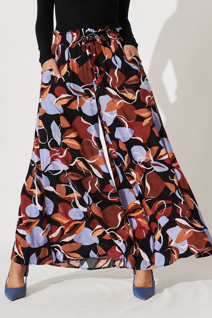 Mariah Pant In Black With Brown And Blue Leaf Print - front