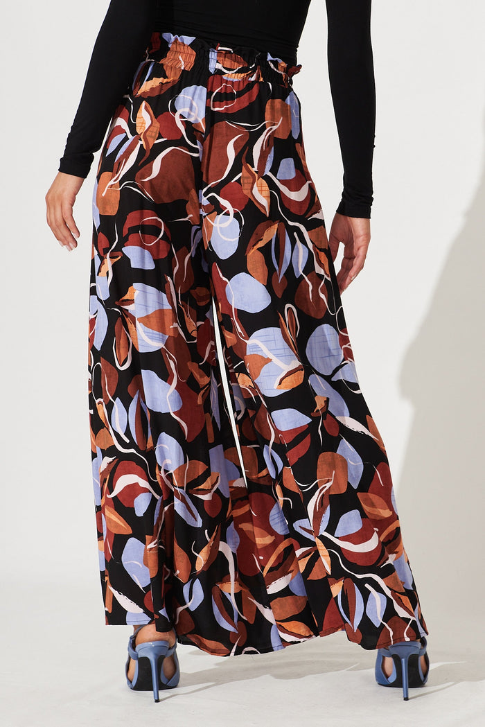 Mariah Pant In Black With Brown And Blue Leaf Print - back