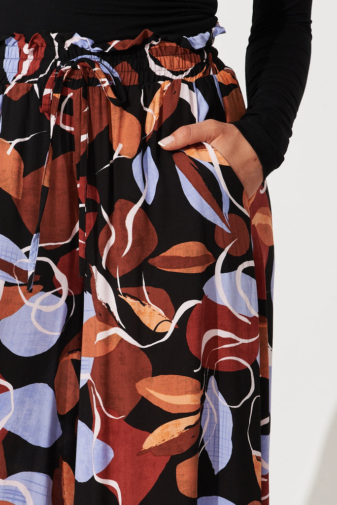 Mariah Pant In Black With Brown And Blue Leaf Print - detail
