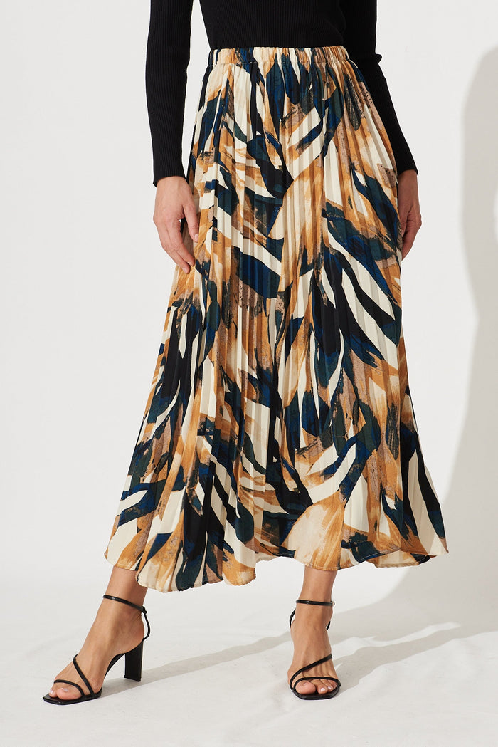 Lyon Pleated Midi Skirt In Rust With Cream And Black Print - front