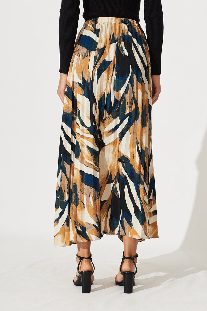 Lyon Pleated Midi Skirt In Rust With Cream And Black Print - back