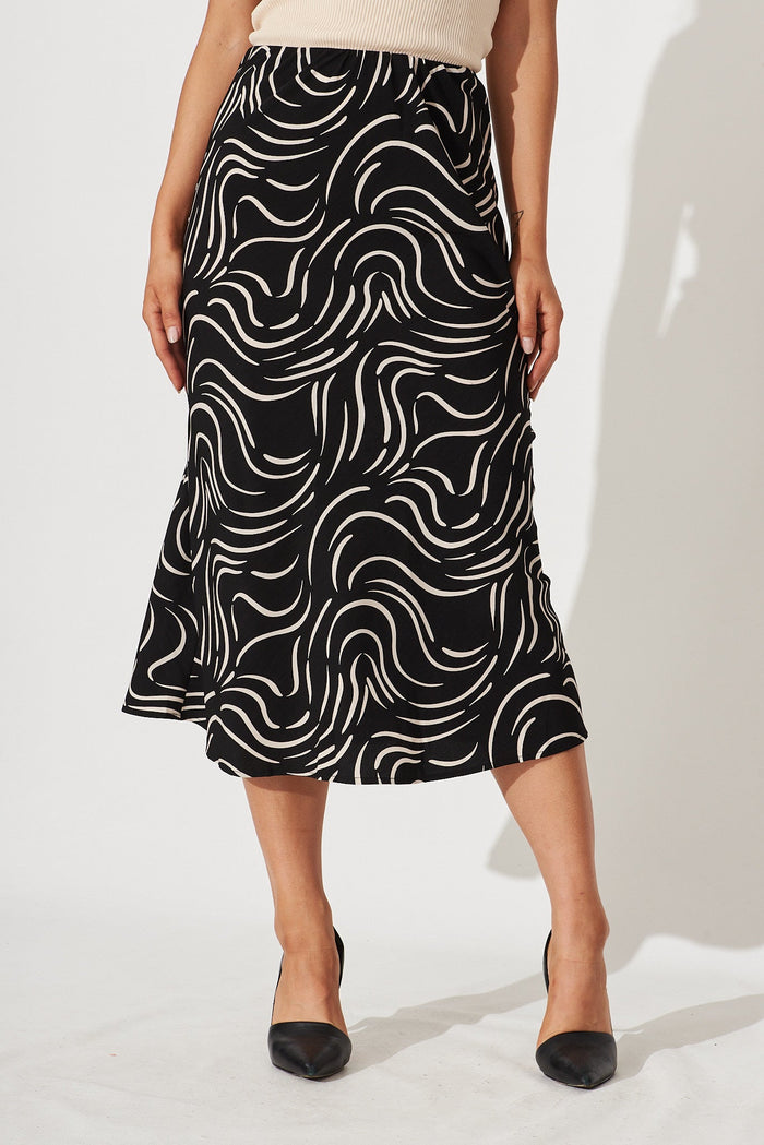 Monica Midi Skirt In Black With Sand Swirl Print - front